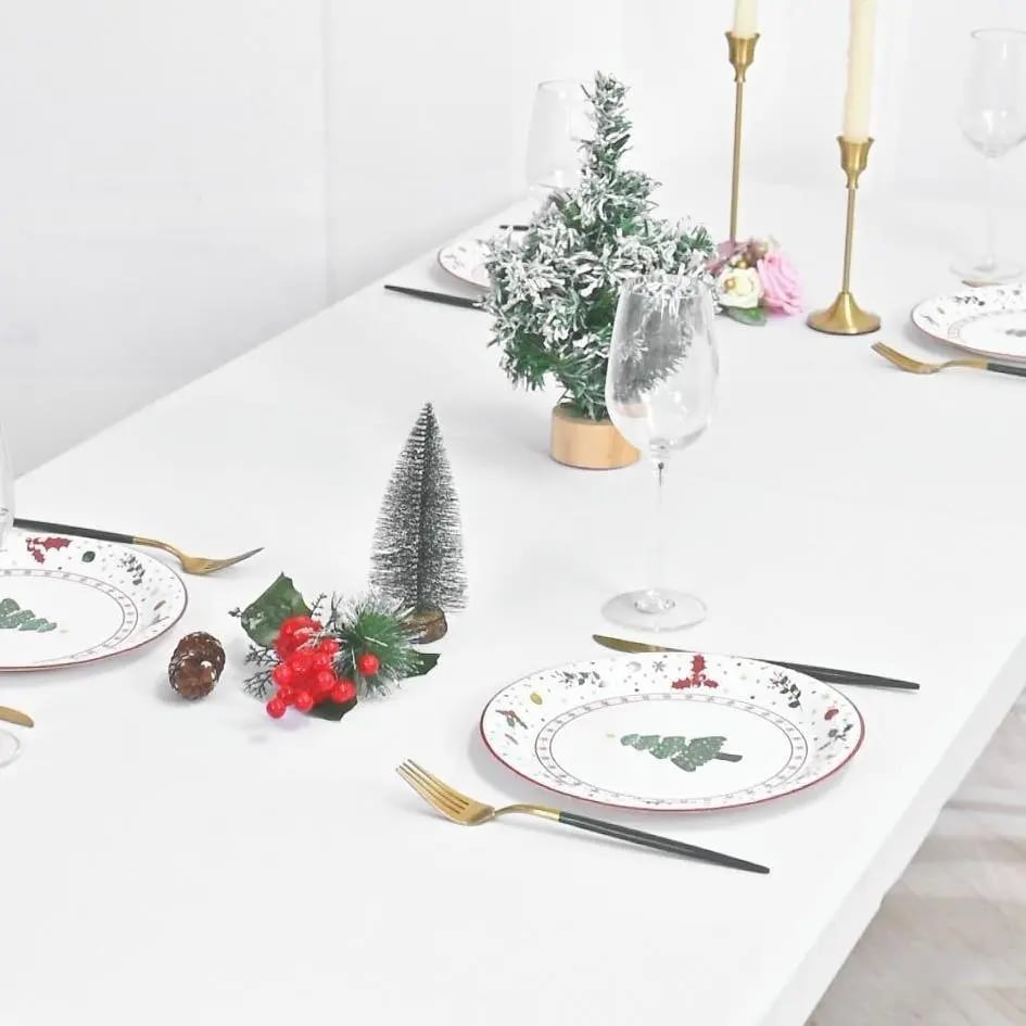 White fitted table cover styled for a holiday meal
