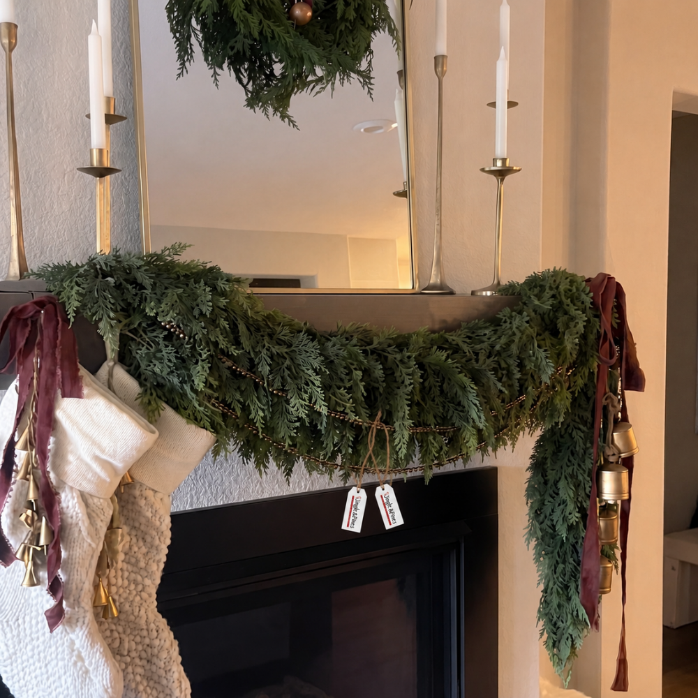 Artificial cedar Christmas garland styled over fireplace